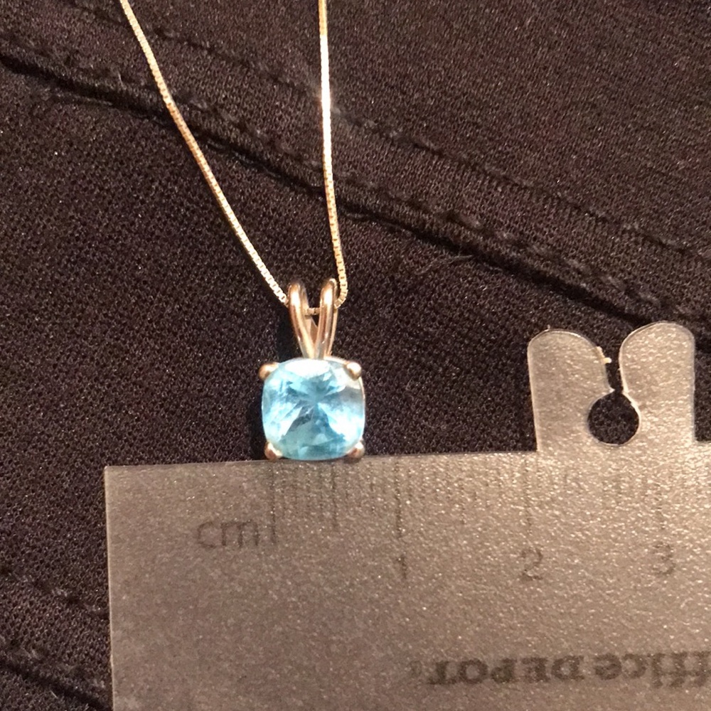 14k solid white gold, blue topaz cushion cut, 7mm.